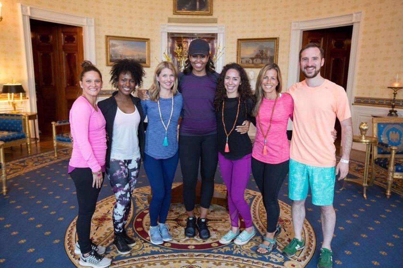 Chris with a group of yoga teachers in the Blue Room of the White House